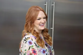 Pioneer Woman Ree Drummond, standing in kitchen, welcomes new dog into family.