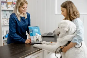 woman with dog visiting veterinary nutritionist